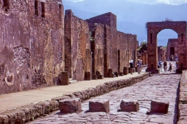 People exploring the ruins of Pompeii