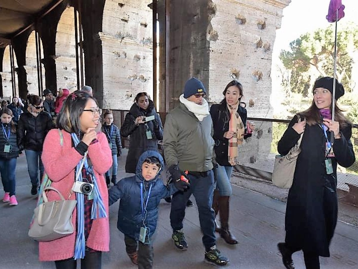 A tour group being led through a tour