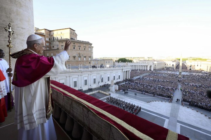 a man standing in front of a building