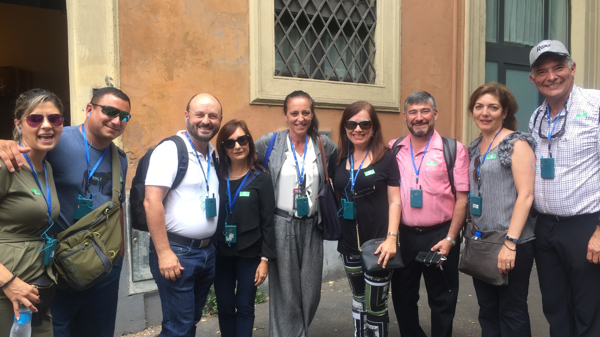 a group of people standing in front of a crowd posing for the camera