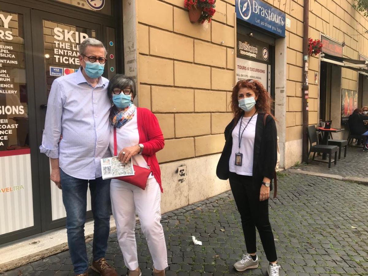 a group of people walking down the street